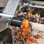 Pool cue tip and ferrule being shaped on a lathe